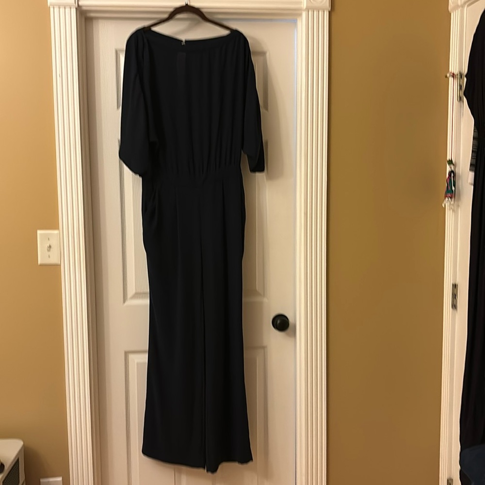 Diane Von Furstenberg navy jumpsuit with pockets and batwing arms. Size 6.